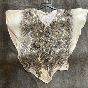 Sheer short sleeve top with cotton inside tank. Rhinestone’s in front